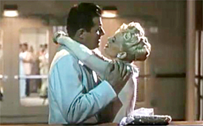 Doris Day and Jack Carson kiss